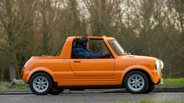 Milton Keynes,Bucks,UK - Jan 1st 2026: 1972 Mini pick up  classic car driving on a British road