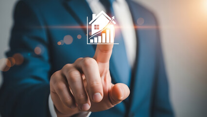 Businessman analyzing real estate market trends with financial graph and house icon for investment and growth strategy