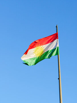 Kurdistan flag flying at the Federal Iraq - Iraqi Kurdistan border checkpoint on a clear morning