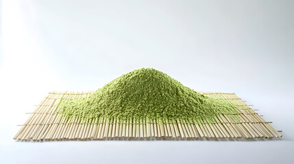 Pile of green tea leaves on bamboo mat