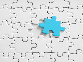Obraz premium Blue puzzle piece finding its missing slot