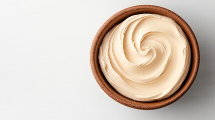 Creamy yogurt in clay bowl against simple white setting emphasizing natural qualities