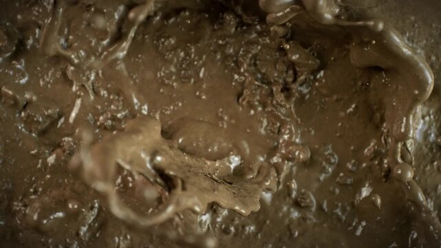 Super Slow Motion Shot of Splashing Mud Background at 1000fps.