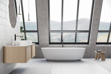 Modern bathroom interior with gray and white tiles wall, concrete floor, wooden vanity with black sink and oval mirror, white bathtub, shower, panoramic windows. 3d Rendering