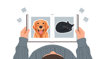 Overhead view of a person holding an open photo album displaying charming pictures of a golden retriever dog and a black cat.