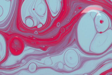 Vivid abstract fluid art with swirling turquoise and red colors, glossy textures, and dynamic circular accents. Shot from above, the composition features flowing movement. macro photography