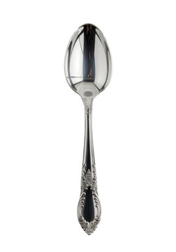 A polished silver tablespoon with ornate, filigree-etched handle and gleaming bowl, sharp reflections, top-down on seamless transparent background. Luxury utensil concept