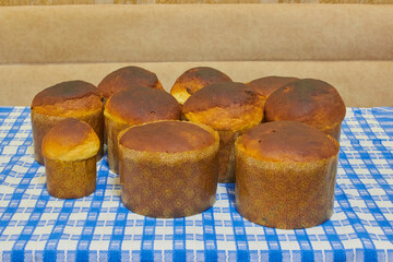Still hot Easter cakes before decoration on the table, several freshly baked Easter cakes on the table, Homemade pastries, many Easter cakes of different sizes