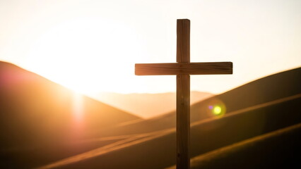Wooden cross silhouette at sunset in hill field landscape. Symbol of faith, hope, and sacrifice for Christian concept and spiritual journey.