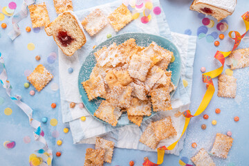 Carnival and party snack with confetti, ribbon and party accessories