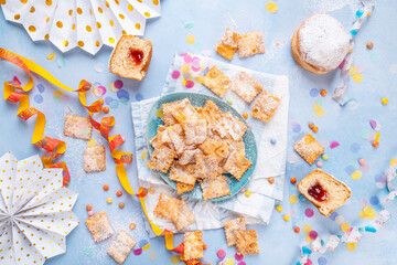 Carnival and party snack with confetti, ribbon and party accessories