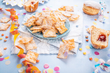 Carnival and party snack with confetti, ribbon and party accessories