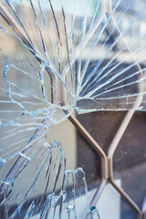 Crime prevention and vandalism concept. Broken display window of a shop.