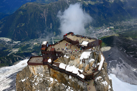 Aiguille du Midi peak (3842), Mont Blanc range, Alps, Haute Savoie, France, Europe : 360 view terraces seen from Skywalk platform, Bossons glacier and Chamonix in Arve valley in background