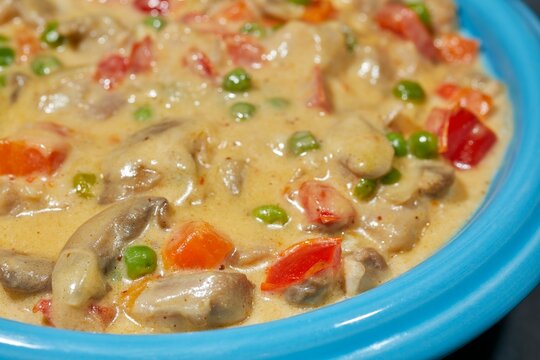 Chicken ala King, a classic American dish, served in a bowl.