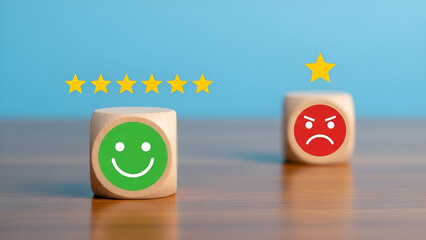 Wooden blocks displaying contrasting customer feedback with a happy face earning four stars and an angry face with only one star