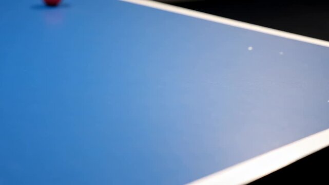 Blue table tennis surface corner with white boundary line and small scratches in professional sport style used for ping pong matches