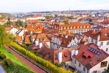 Fototapeta premium Praha tile roofs architecture in Prague Czech Republic Old street house building top view cityscape