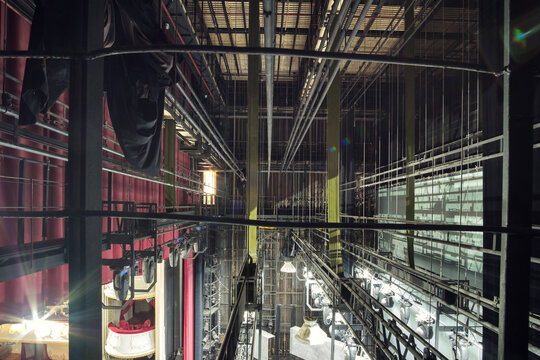 Technical equipment at the backstage of theater. Stage spot lighting rigging structure for a live musical theater events