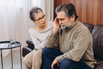 Psychologist supporting senior man suffering from stress