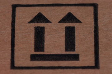 Two arrows pointing up on a carton within a square or above a line, is the universal "This Side Up" or "This Way Up" symbol, meaning the box must remain upright during handling, shipping, and storage 