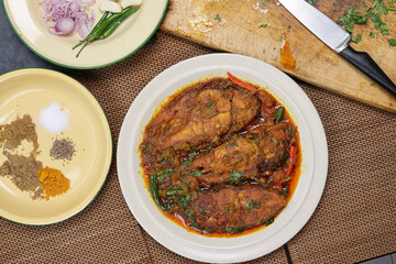 Asian Bengali style barramundi siakap fish curry recipe ingredients tomato chopped onion garlic ginger green chili cumin coriander turmeric salt