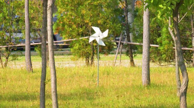 Colorful pinwheels spinning in breeze