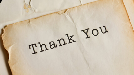 Vintage style thank you text on aged paper ideal for designs on transparent background