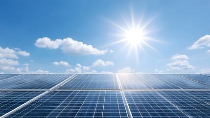A wide view of solar panels bathed in bright sunlight against a clear blue sky with wispy clouds representing renewable energy technology and environmental sustainability