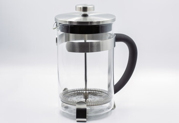 French press tea coffee maker with stainless steel frame closeup.