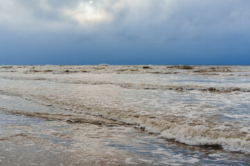 Stormy Sea Waves Crashing on Coastline under Dramatic Dark Sky