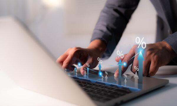Businessman hand touching percentage graph, rate increases, Mortgage interest rate growth. Retirement, compensation fund, investment, dividend tax, stock market. representing business growth.