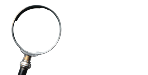 Magnifying glass with dark handle on black background, focused light reflecting on the rim of the glass