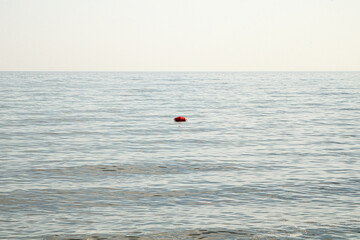 Solitary Buoy Floating in Calm Sea