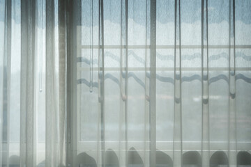 Closeup of beautiful white shiny crumpled  fabric sheets on the bed