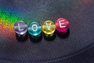 Abstract the word love written with colorful beads