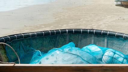  Traditional Vietnamese basket boats on sandy beach. High quality photo (coracle boats) Local fishing equipment and coastal lifestyle in Vietnam, Southeast Asia. No people, outdoor daytime scene. 