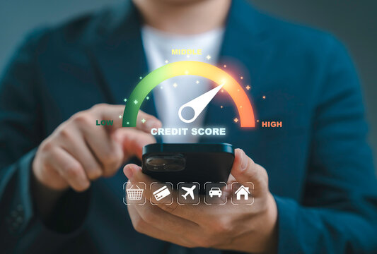 Businessman using smartphone with digital credit score meter from low to high representing financial health credit evaluation loan approval responsible spending and modern fintech banking concept. - Powered by Adobe