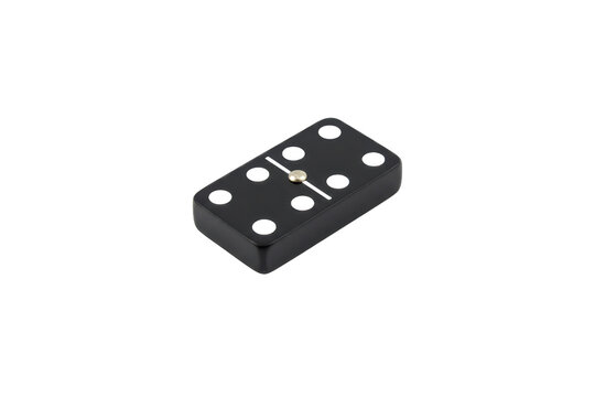 A solitary black domino with a silver pin rests on a sleek, reflective dark surface