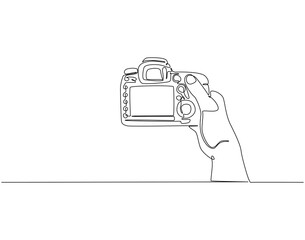 Continuous line drawing of hand holding camera. Single line illustration of hand hold camera. Photograph, journalist concept. Editable outline