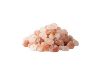Pile of coarse pink Himalayan salt crystals scattered on a pale peach surface