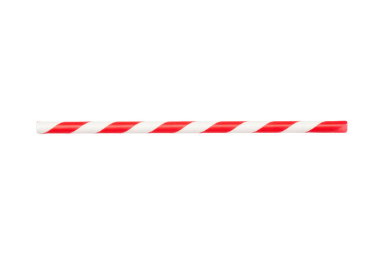 Red and white striped drinking straw on a bright surface casting a shadow with artistic visual