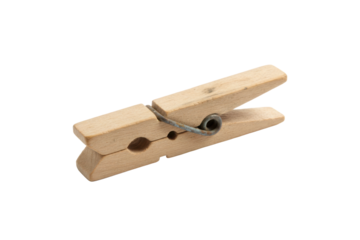 Single wooden clothespin with a metal spring detail on a plain surface