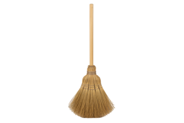 Traditional broom with natural fibers and wooden handle standing upright on a plain surface