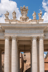 Vatican - Vatican City - St Peters Square - Detail of Chigi Coat of Arms and saints statues on top of Bernini Colonnade