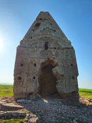Ancient ruins of a weathered red brick temple with crumbling mortar, historic masonry details, and aged architectural texture.