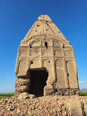Ancient weathered red brick temple ruins featuring crumbling masonry, historic architecture, and aged stone textures.