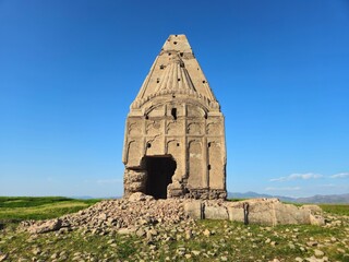 Ancient ruins of a weathered red brick temple with crumbling mortar, historic masonry details, and aged architectural texture.