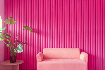 Modern interior design of a luxury living room apartment featuring a comfortable pink armchair and purple sofa with contemporary pink wall furniture and stylish home decor