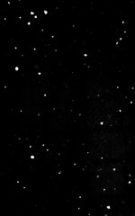 Light snowfall overlay on black background. High quality photo